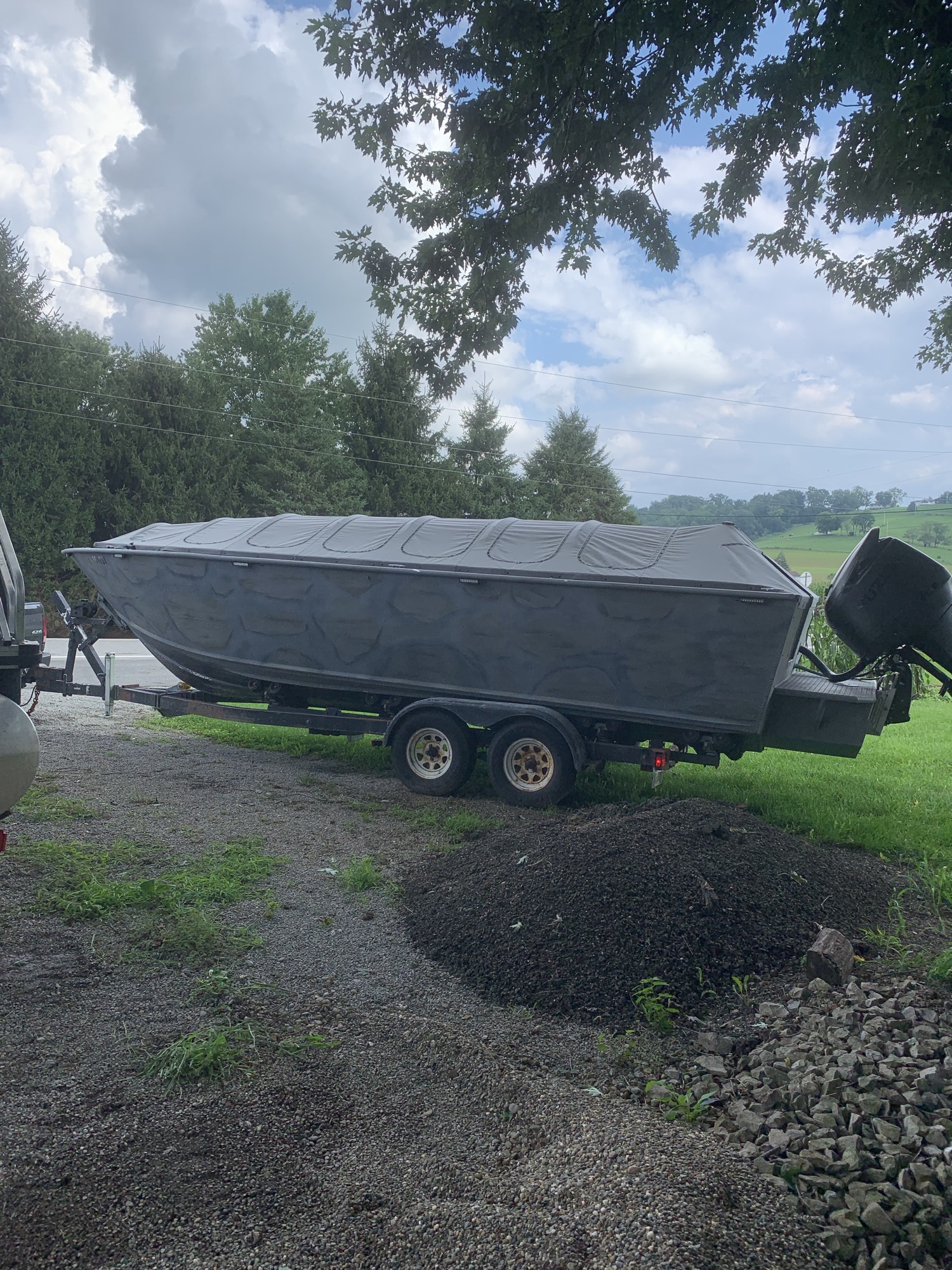 Boat with layout-style blind on the trailer